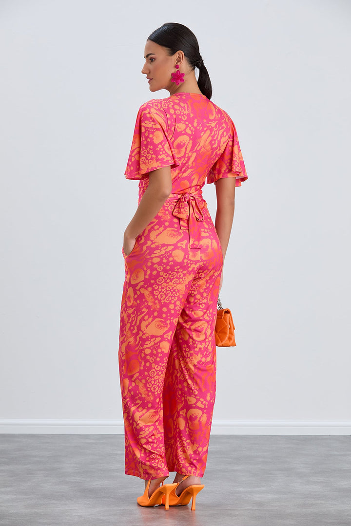 Angel Sleeve Twist Maxi Jumpsuit in Tropical Fuchsia print - jqwholesale.com