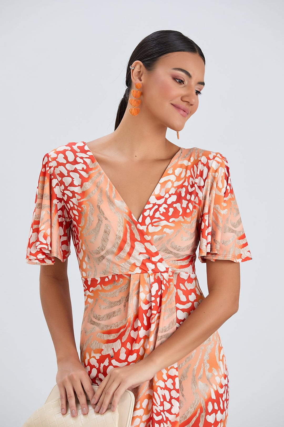 Flirty Flutter Sleeve Wrap Midi Dress in Orange Animal Print - jqwholesale.com