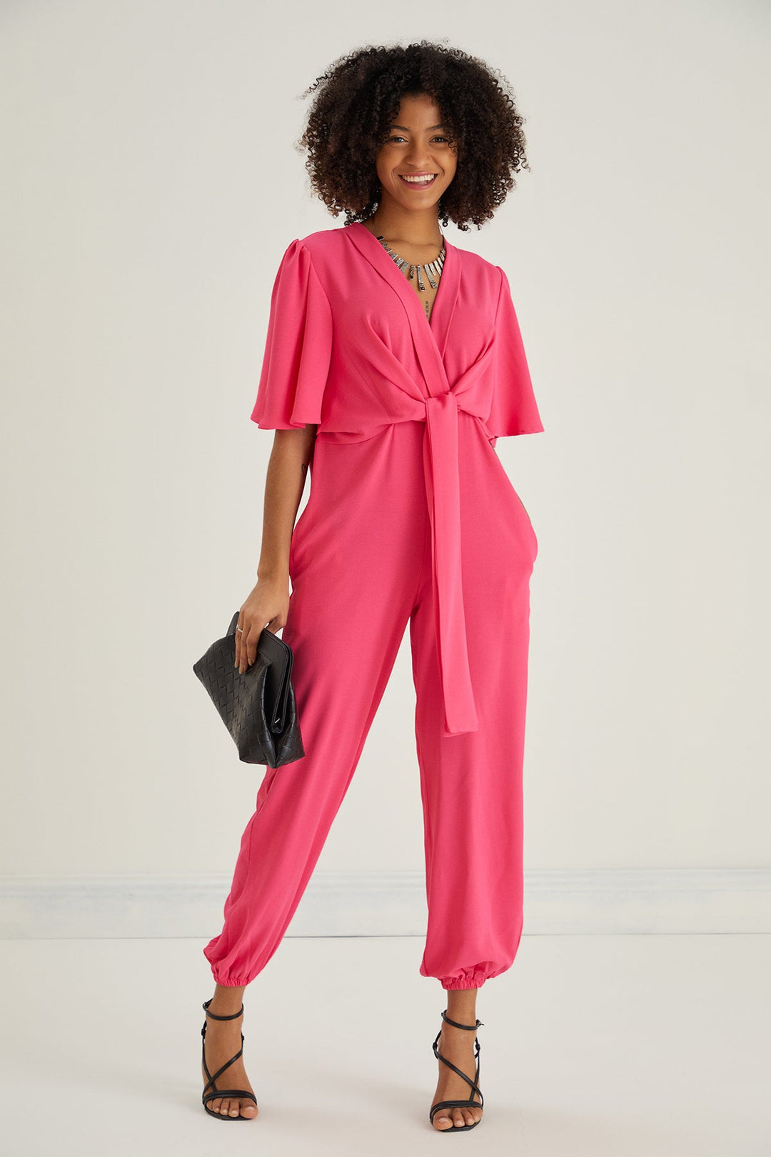Jessica Angel Sleeve Wrap Jumpsuit in Pink - jqwholesale.com