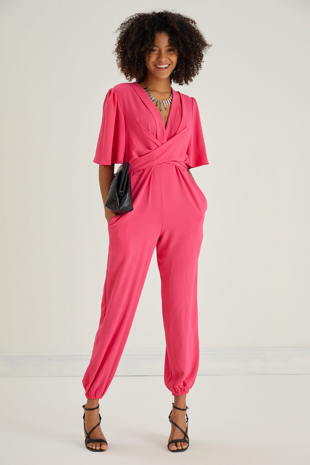 Jessica Angel Sleeve Wrap Jumpsuit in Pink - jqwholesale.com